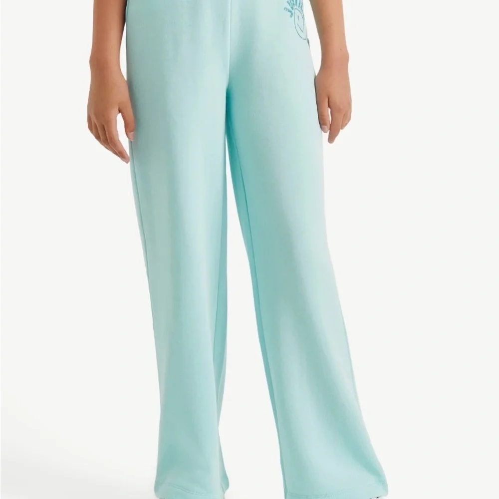 Justice Light Blue Sweatpants with Smiley Graphic